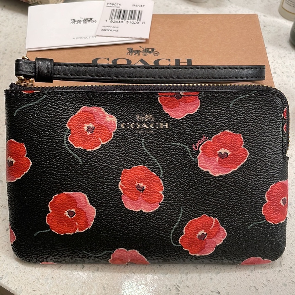 Coach wristlet with red flowers, new with box and tag